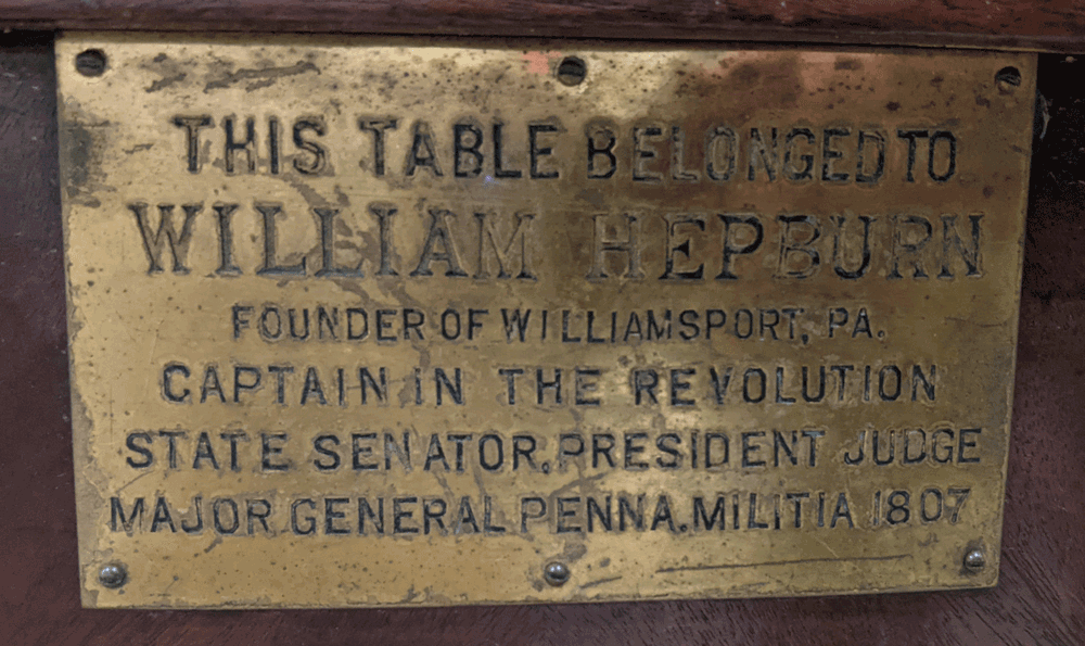 Plaque on dining table that once belonged to William Hepburn