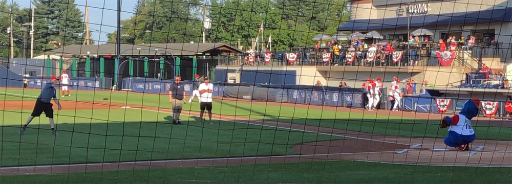 Gary Weber throwing the first pitch to Boomer