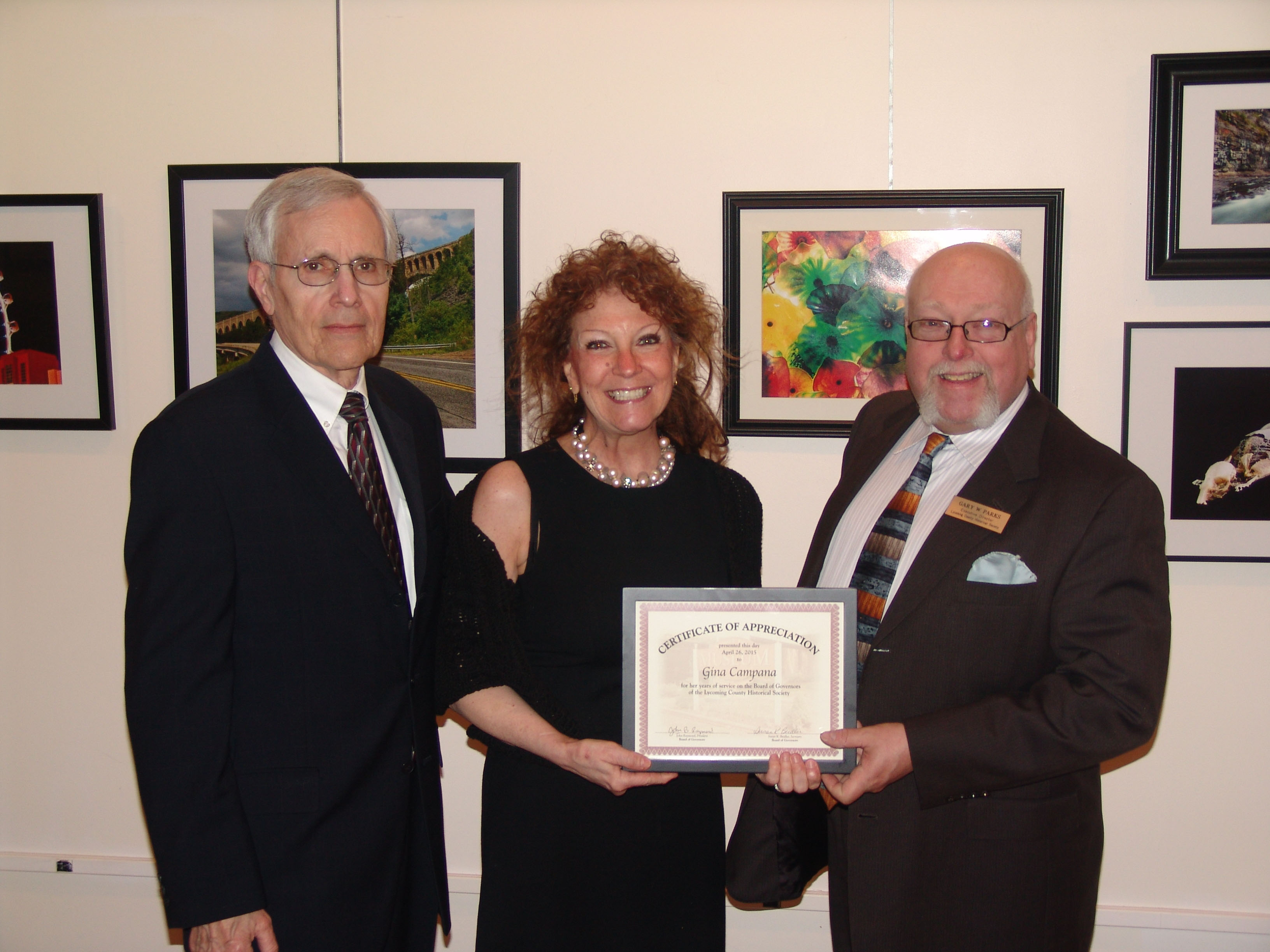 Outgoing Board member Gina Campana receiving a certificate of appreciation from newly-elected Board President Chuck Luppert and Director Gary Parks.